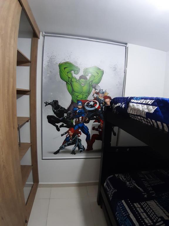 Ένα ή περισσότερα κρεβάτια σε δωμάτιο στο Aparta-Hotel Cafetero Oviedo