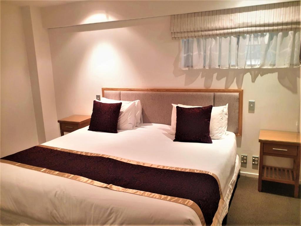 Postel nebo postele na pokoji v ubytování Fino Hotel & Suites