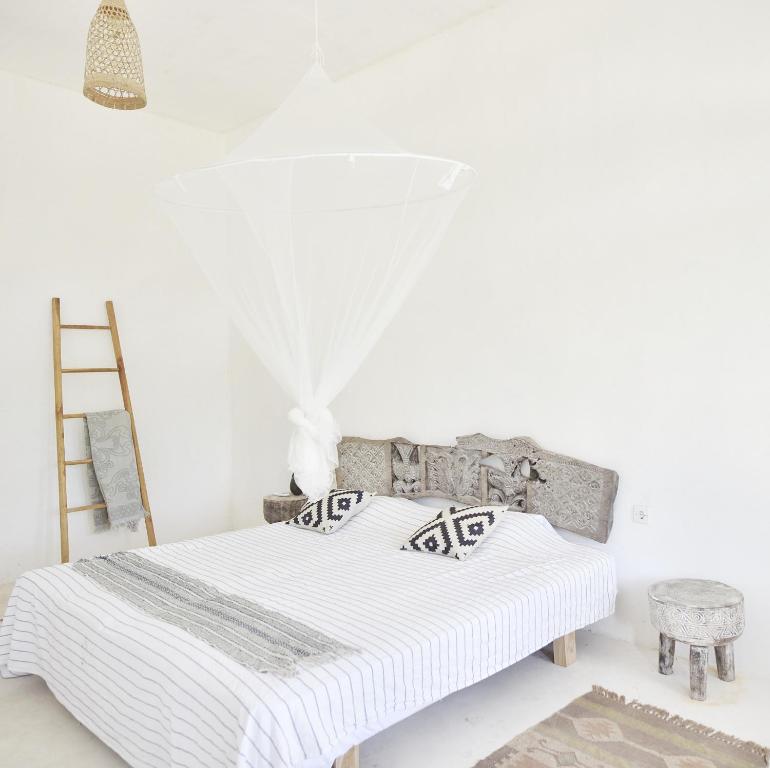 Postel nebo postele na pokoji v ubytování Lambo Homestay