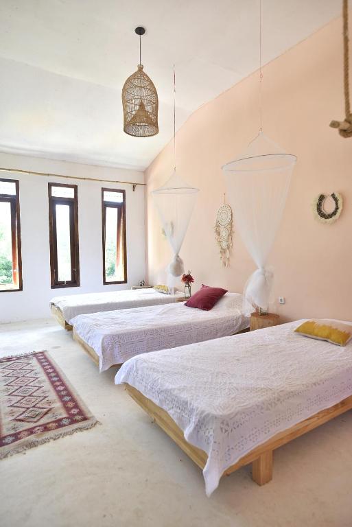 Postel nebo postele na pokoji v ubytování Lambo Homestay