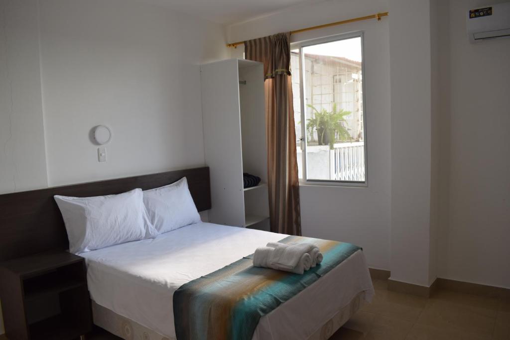 Postel nebo postele na pokoji v ubytování Mare S&M Casa Hostal