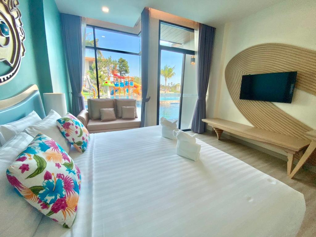 Postel nebo postele na pokoji v ubytování Elmas Cha Am Design Hotel