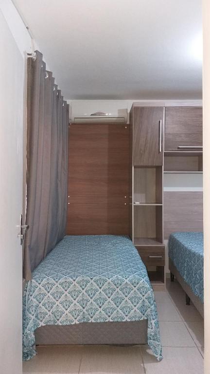 Residencial Costa do Encanto tesisinde bir odada yatak veya yataklar
