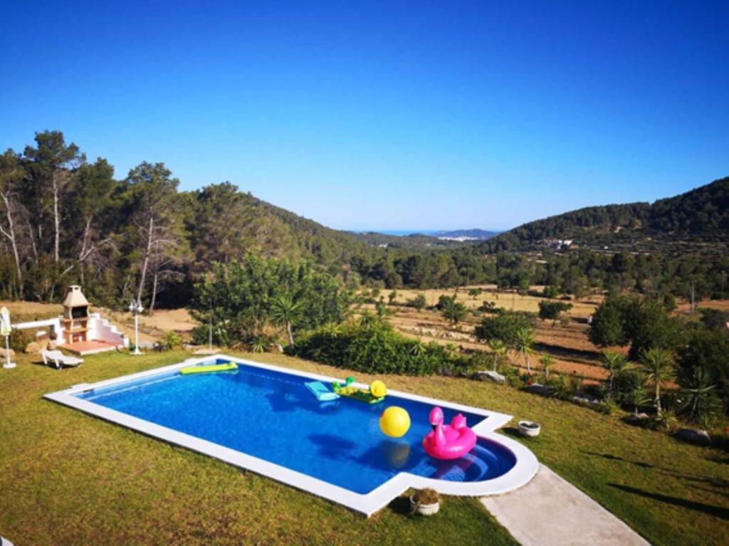 an image of a swimming pool in a yard at Can Ramón in Sant Josep de sa Talaia