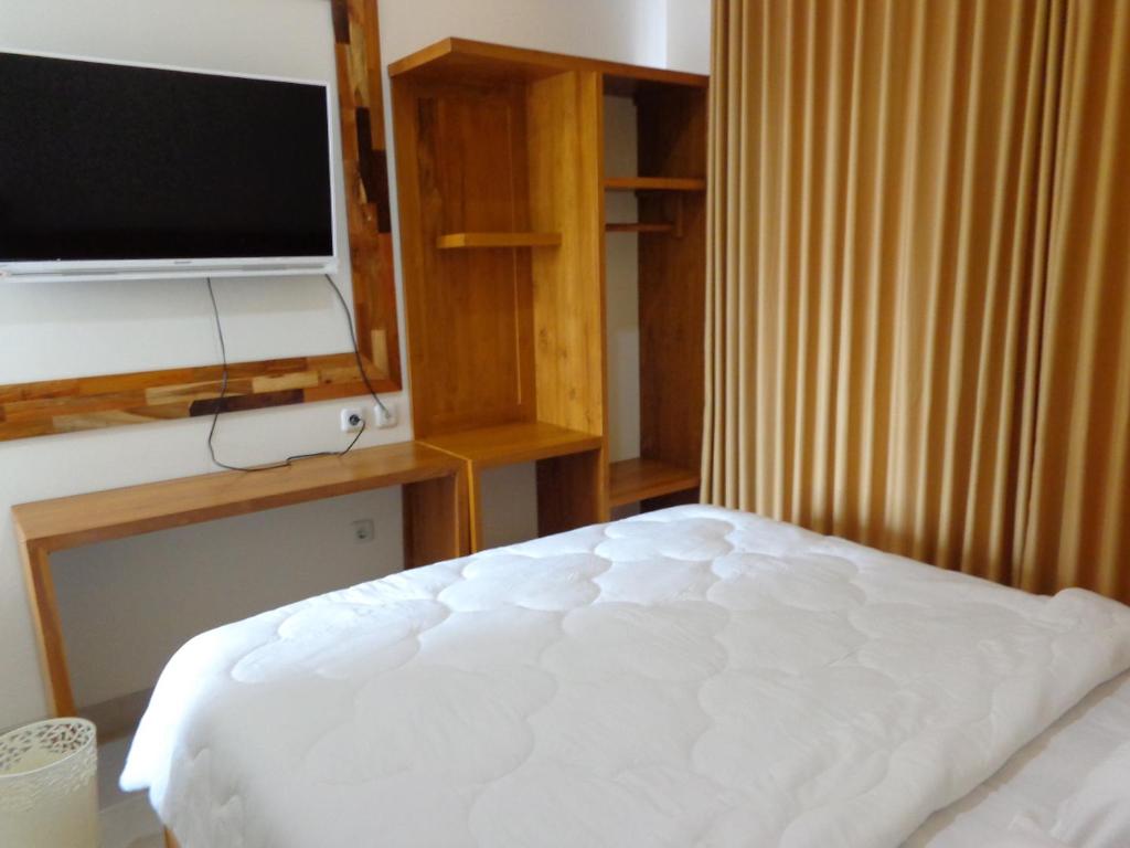 Postel nebo postele na pokoji v ubytování Diva Residence