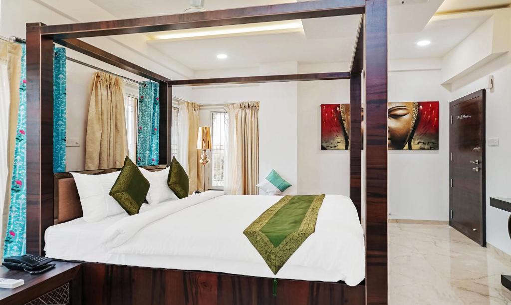 a bedroom with a large bed with a large mirror at Treebo Trend Hotel A1 in Nagpur