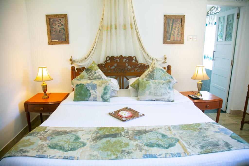 Postel nebo postele na pokoji v ubytování Manor House-Kandy