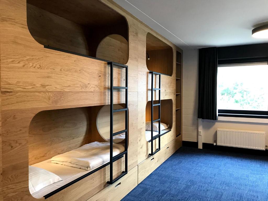 Postel nebo postele na pokoji v ubytování Vakantiedomein Hoge Duin