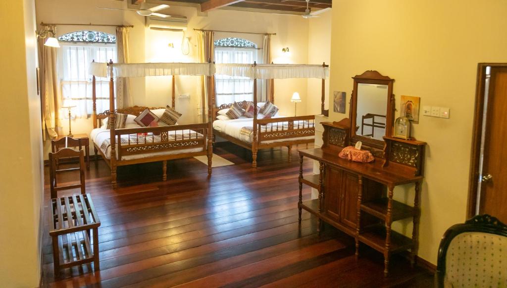 Postel nebo postele na pokoji v ubytování Manor House-Kandy