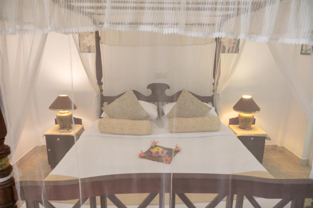 Postel nebo postele na pokoji v ubytování Manor House-Kandy