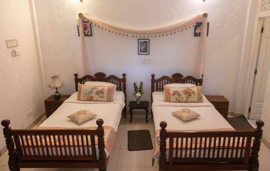 Postel nebo postele na pokoji v ubytování Manor House-Kandy