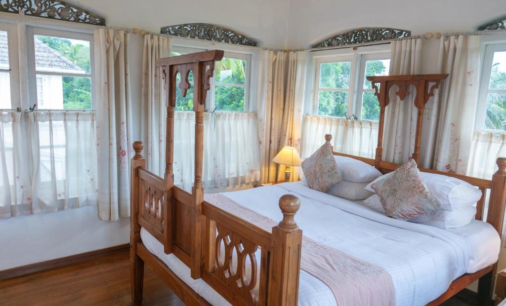 Postel nebo postele na pokoji v ubytování Manor House-Kandy