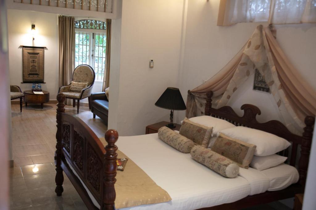 Postel nebo postele na pokoji v ubytování Manor House-Kandy