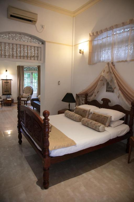 Postel nebo postele na pokoji v ubytování Manor House-Kandy