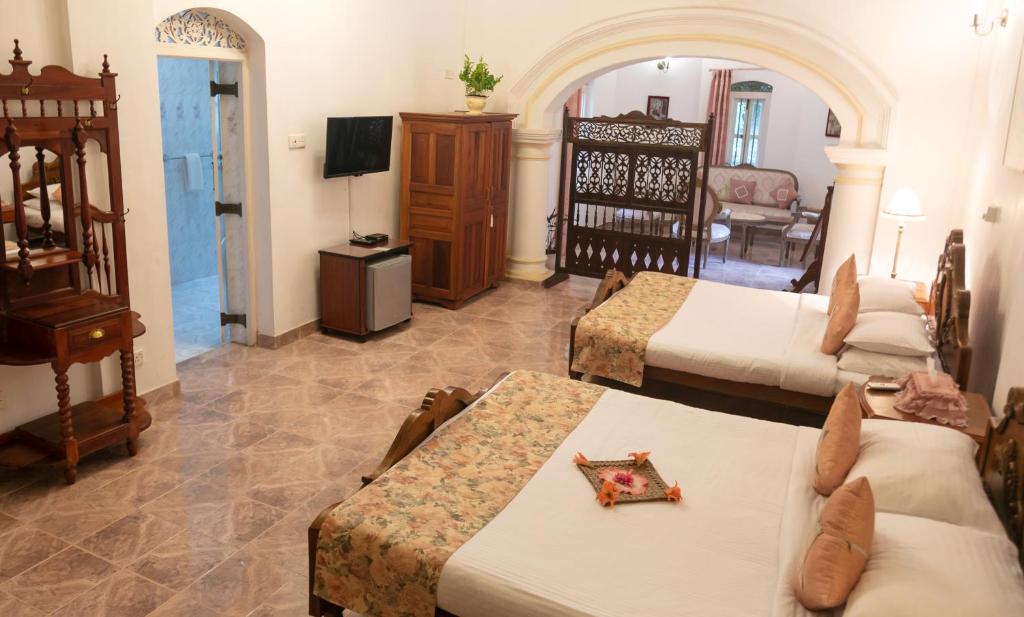 Postel nebo postele na pokoji v ubytování Manor House-Kandy