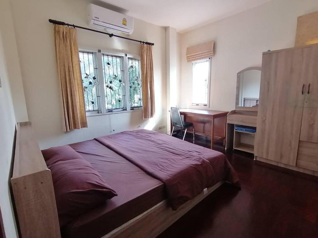 Postel nebo postele na pokoji v ubytování Poolvilla Armthong Home