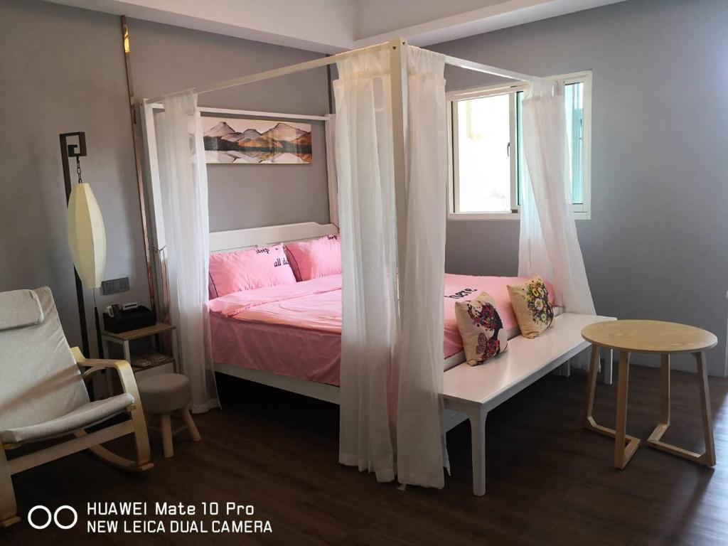 Voodi või voodid majutusasutuse Jiji Wu Homestay toas