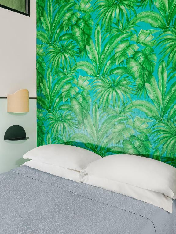 Postel nebo postele na pokoji v ubytování Hotel Riviera