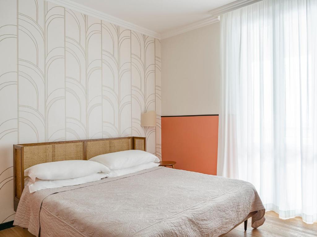 Postel nebo postele na pokoji v ubytování Hotel Riviera