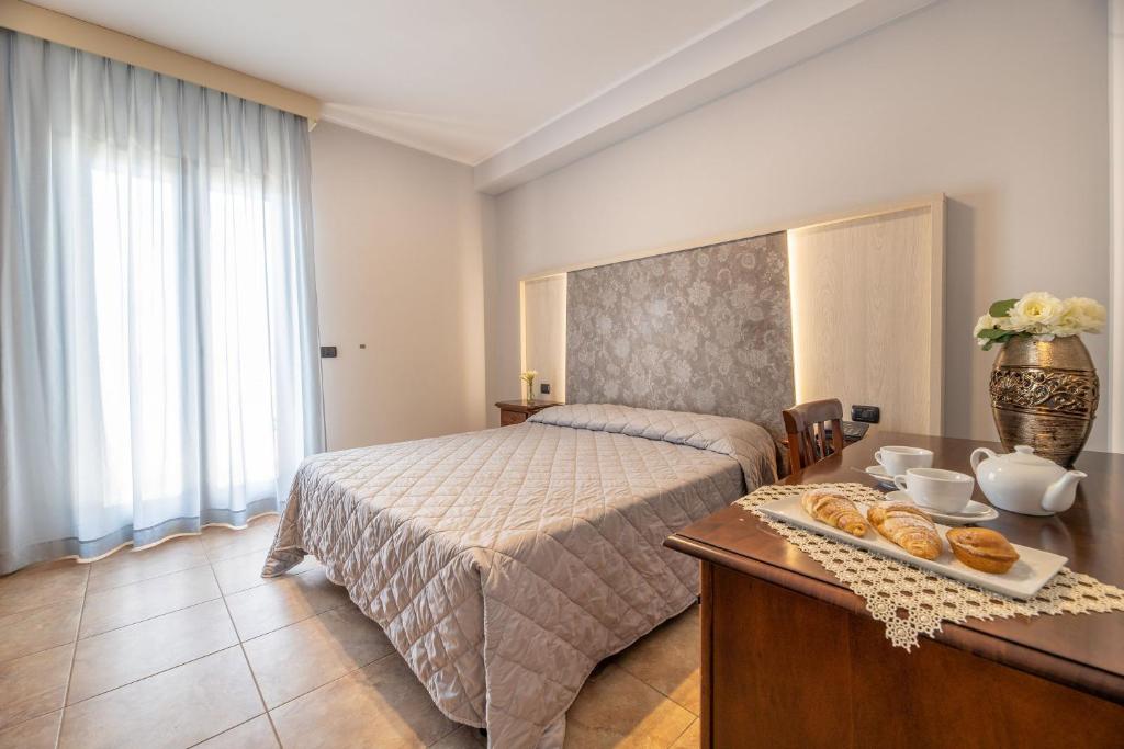Postel nebo postele na pokoji v ubytování Hotel Salento Mirfran