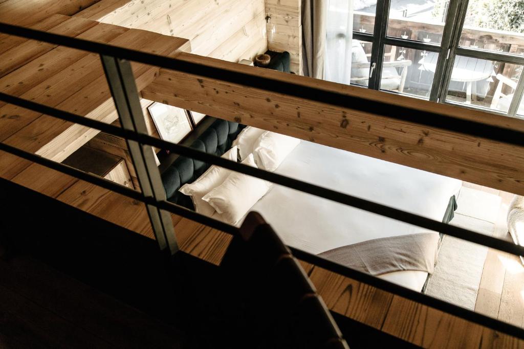 a view from the top of a room with a window at L'Alpaga, a Beaumier hotel in Megève