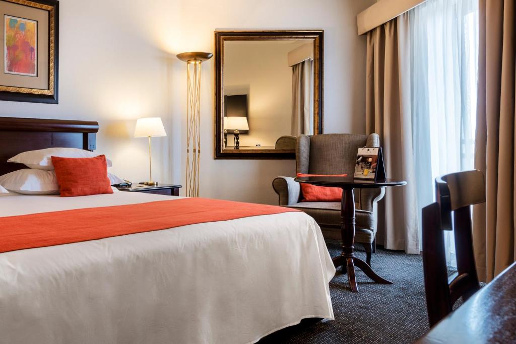 Postel nebo postele na pokoji v ubytování Hotel Alvalade