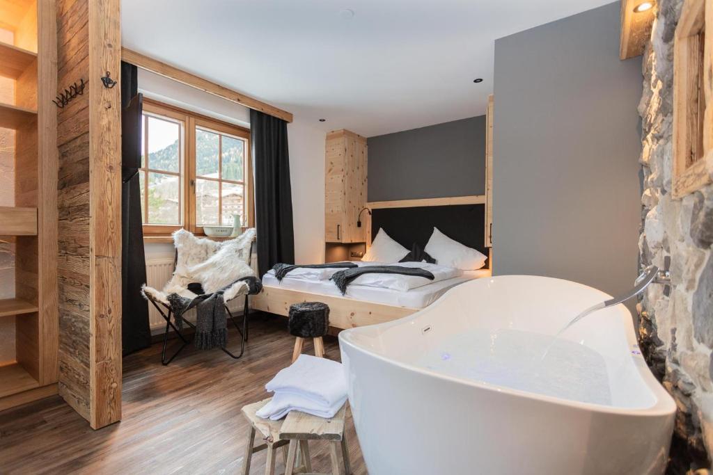 Postel nebo postele na pokoji v ubytování Hotel Sonnberg