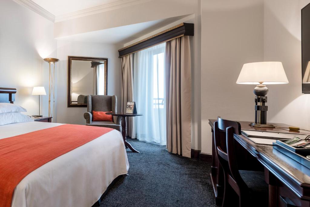 Postel nebo postele na pokoji v ubytování Hotel Alvalade