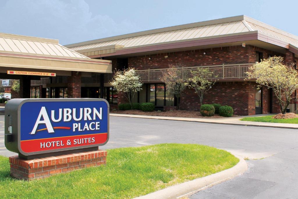 a sign in front of a hotel and suites at Auburn Place Hotel & Suites Cape Girardeau in Cape Girardeau