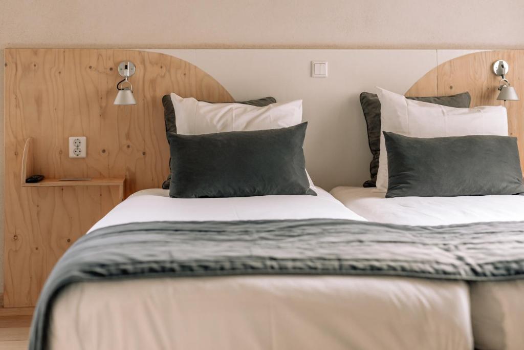 Postel nebo postele na pokoji v ubytování Asgard Hotel