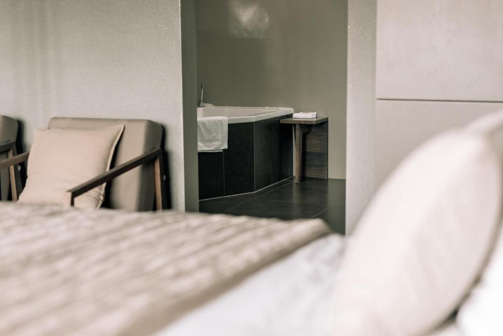 Postel nebo postele na pokoji v ubytování Asgard Hotel