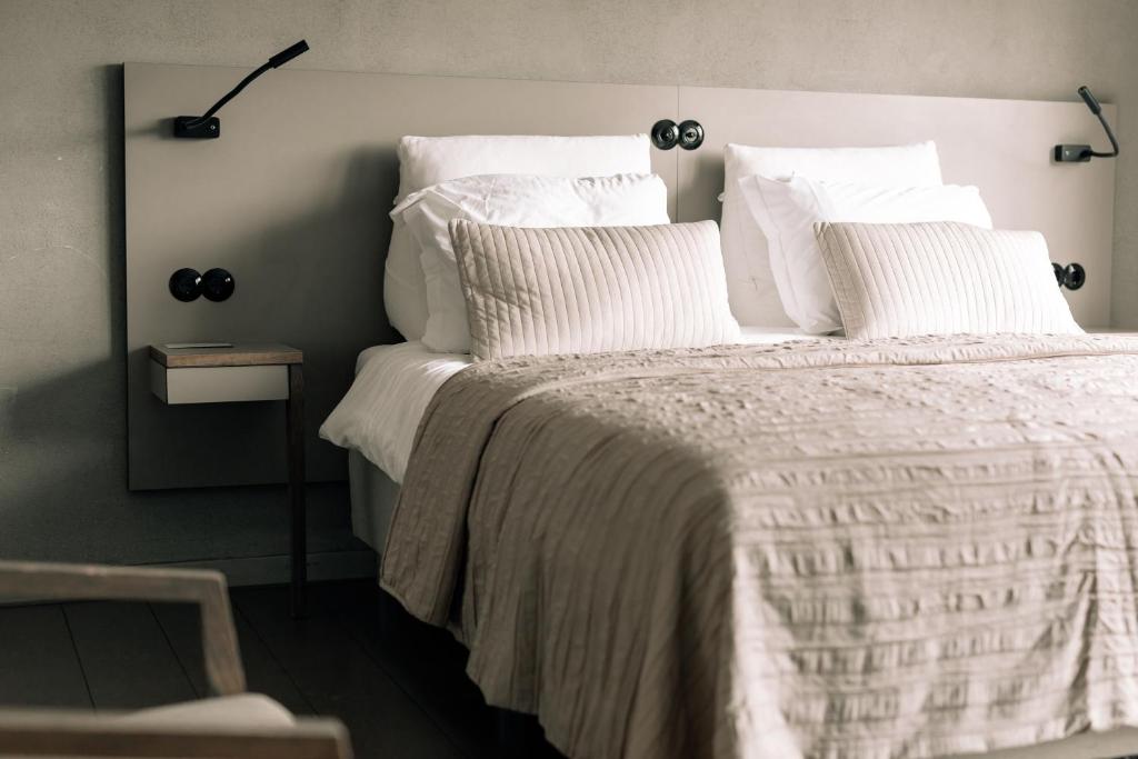 Postel nebo postele na pokoji v ubytování Asgard Hotel