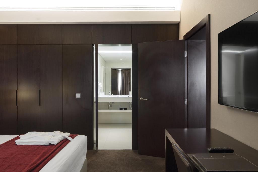 Voodi või voodid majutusasutuse Hotel Trópico toas