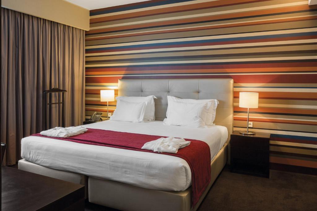 Voodi või voodid majutusasutuse Hotel Trópico toas