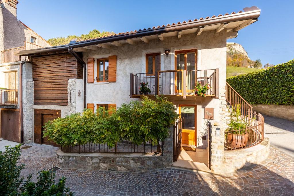 a house with a porch and a balcony at Borgo Cantagallo Casa Olivia 2 in Tremosine Sul Garda