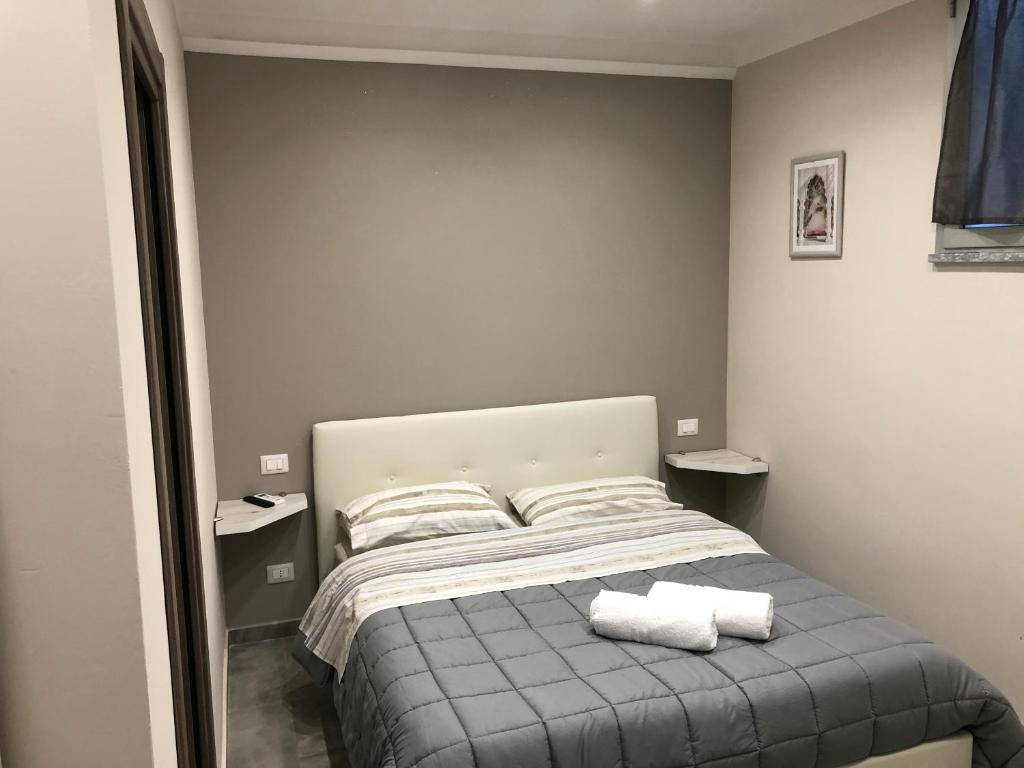 Tempat tidur dalam kamar di Le Mirage boutique