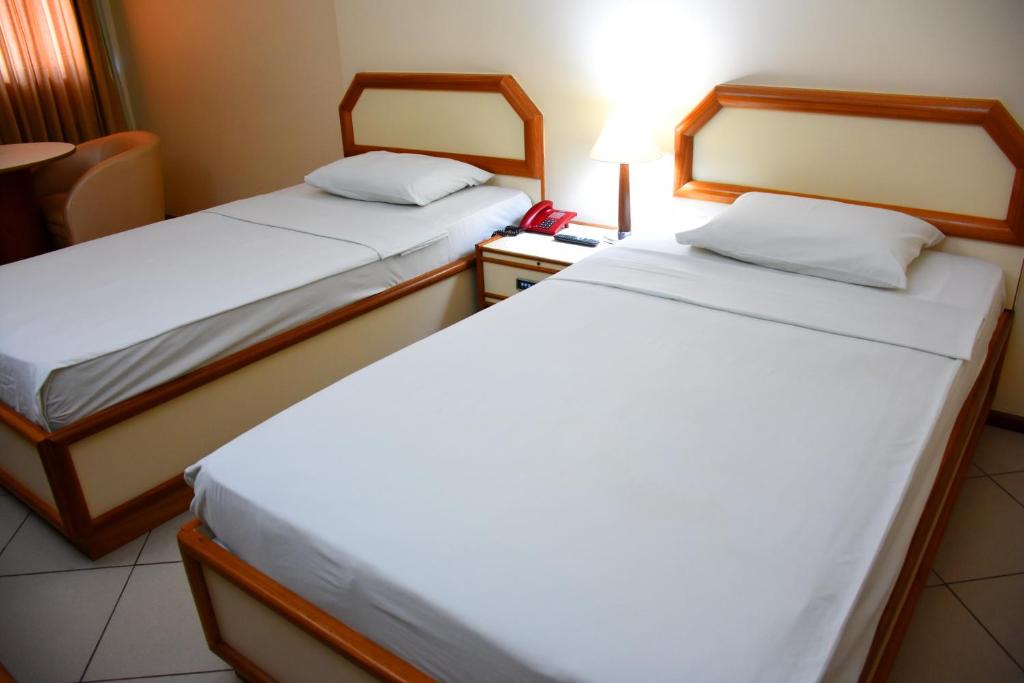 Uma cama ou camas num quarto em Hotel Grão Para