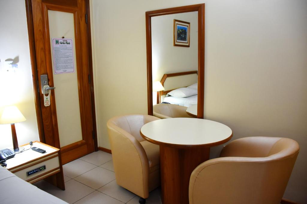 Uma cama ou camas num quarto em Hotel Grão Para