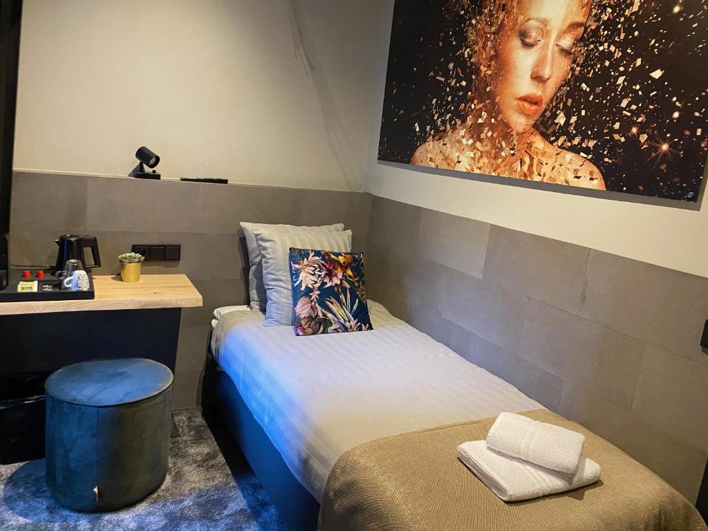 Postel nebo postele na pokoji v ubytování Hotel de Prince
