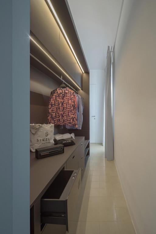 Postel nebo postele na pokoji v ubytování Sikelia Suites