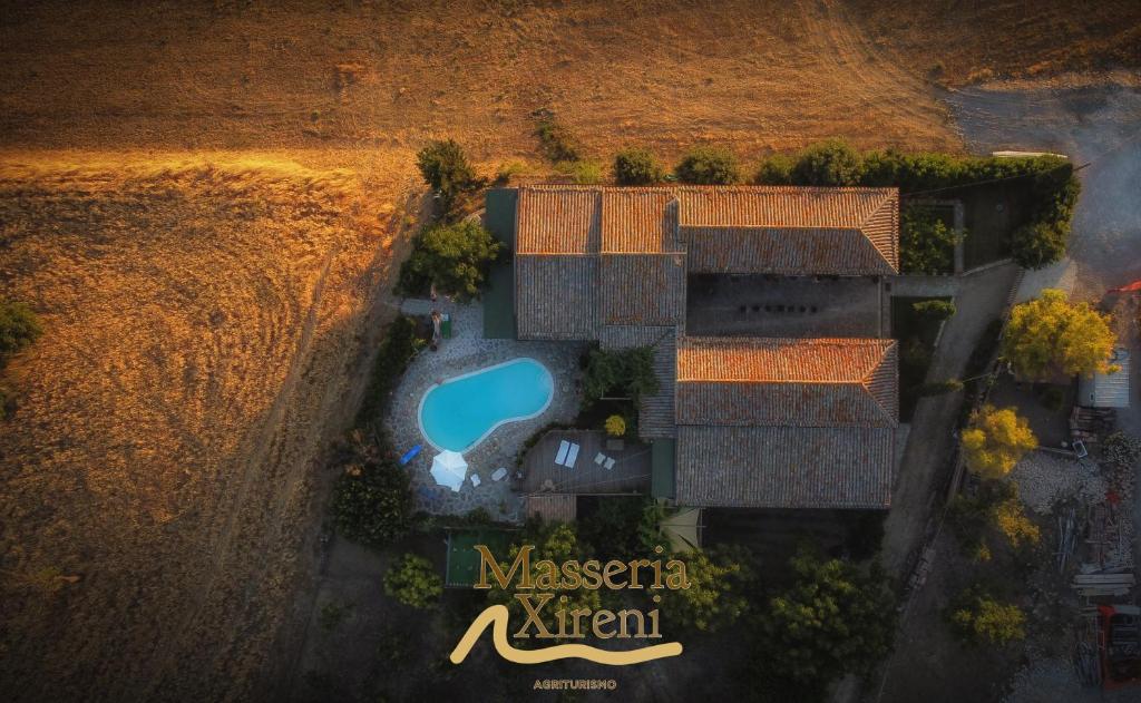 an overhead view of a villa with a swimming pool at Masseria Xireni in Castellana Sicula