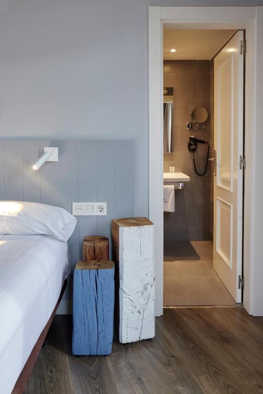 Postel nebo postele na pokoji v ubytování Hotel Avenida