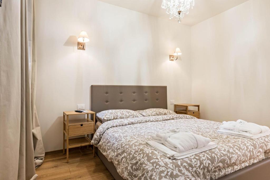 Łóżko lub łóżka w pokoju w obiekcie Wellness Lodge Riccardo