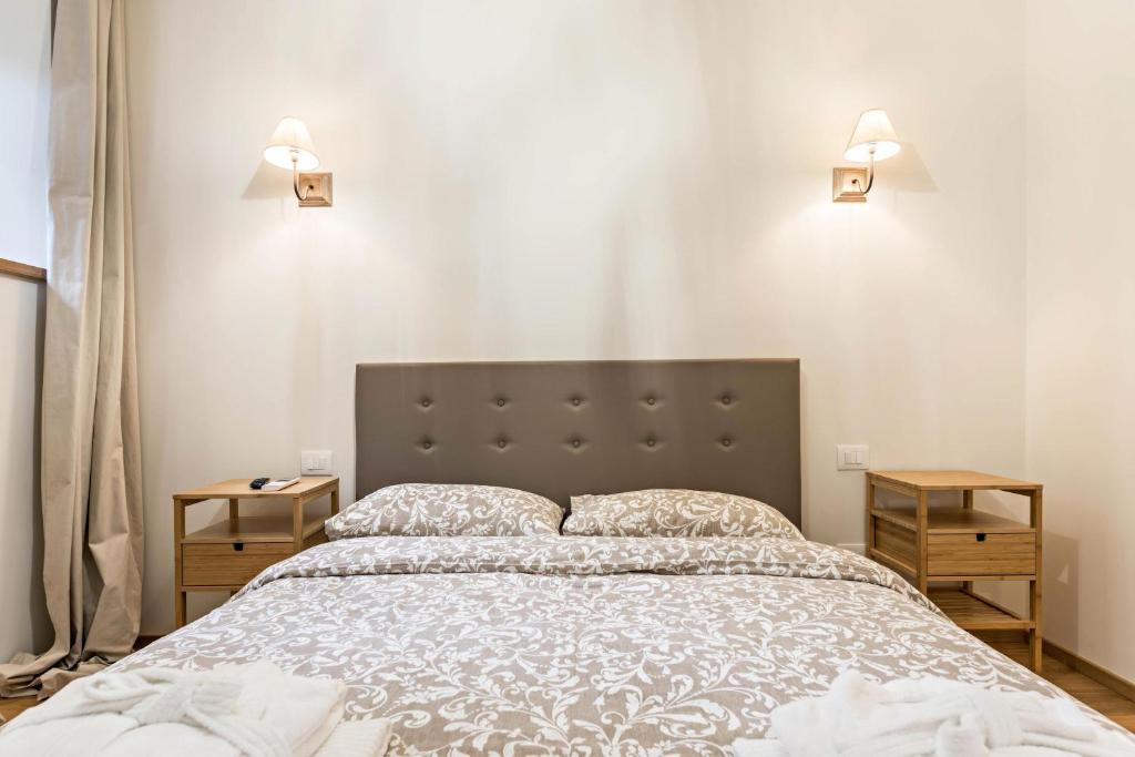 Łóżko lub łóżka w pokoju w obiekcie Wellness Lodge Riccardo