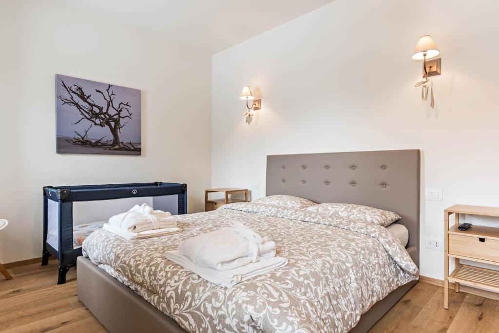 Łóżko lub łóżka w pokoju w obiekcie Wellness Lodge Riccardo