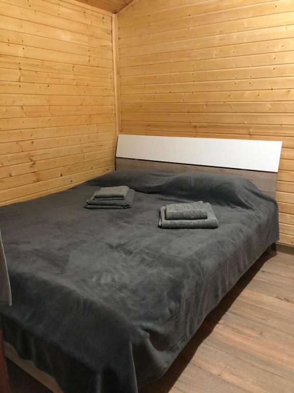 Postel nebo postele na pokoji v ubytování Roua Muntelui
