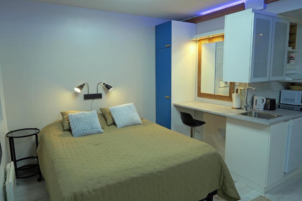 Кровать или кровати в номере Apartments Tahko