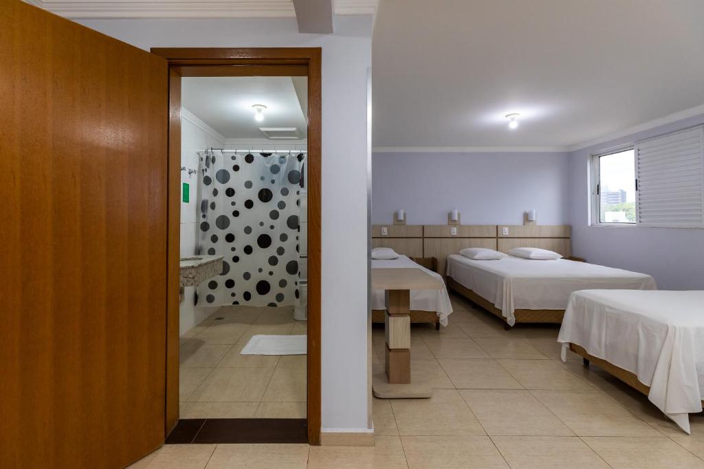 Postel nebo postele na pokoji v ubytování Hotel Baviera Iguassu