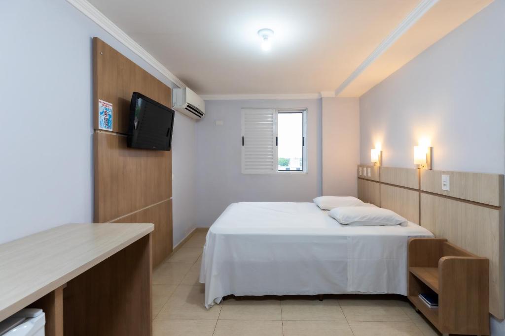 Postel nebo postele na pokoji v ubytování Hotel Baviera Iguassu