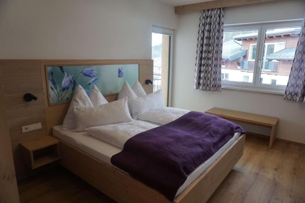 Posteľ alebo postele v izbe v ubytovaní Appartements Blumenwiese